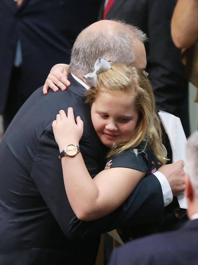 Mr Morrison hugs his daughter Lily after delivering his speech. Picture: Kym Smith