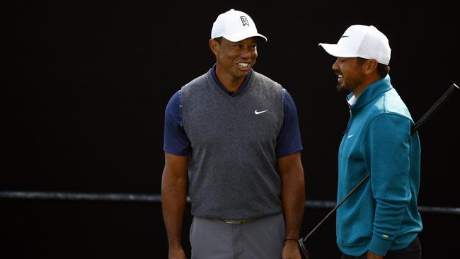 Jason Day and Tiger Woods earlier this year. (Photo by Ronald Martinez/Getty Images)