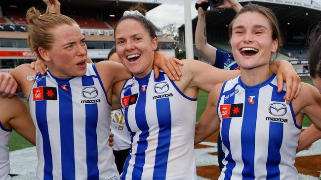 MELBOURNE, AUSTRALIA - NOVEMBER 23: The Kangaroos sing the team song during the 2024 AFLW First Preliminary Final match between the North Melbourne Tasmanian Kangaroos and the Port Adelaide Power at IKON Park on November 23, 2024 in Melbourne, Australia. (Photo by Dylan Burns/AFL Photos via Getty Images)