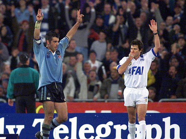 Ryan Girdler raises his arms in victory as referee Bill Harrigan blows full-time at the end of 2000 Origin series.