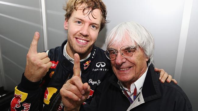 Sebastian Vettel of Germany and Red Bull Racing celebrates in his changing room with F1 supremo Bernie Ecclestone after the B...