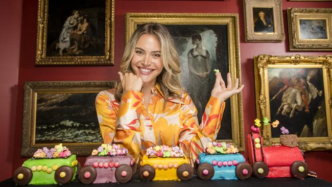 Alice Hayward with the popular train cake from The Australian Women's Weekly Children's Birthday Cake Book, which will be part of an exhibition celebrating the iconic book’s 40th anniversary during the Melbourne Food and Wine Festival. Picture: Eugene Hyland