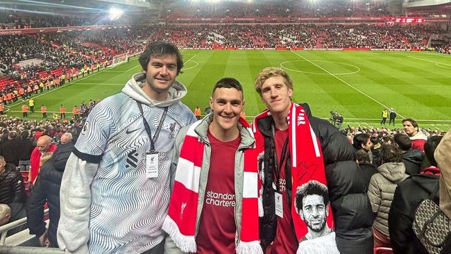 You’ll never walk alone: Swans players Logan McDonald, Errol Gulden and Dylan Stephens at Anfield watching Liverpool. Picture: Instagram