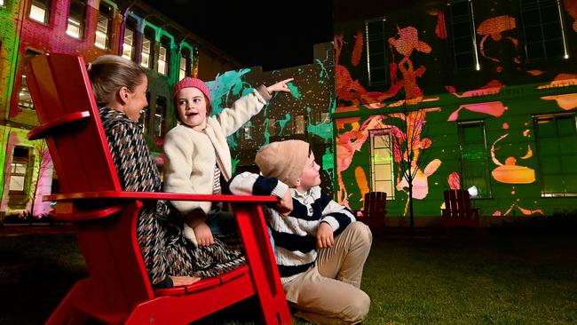 Bec Hoffmann with her children Harry, 9 and Lola, 7, check out the Illuminate Adelaide – City Lights installation at Lot 14 on North Terrace. Picture: Naomi Jellicoe.