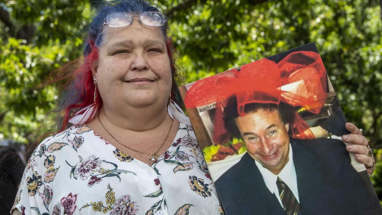 Margaret Casey with a portrait of her partner Dwane Casey. Family and friends remember Dwane Casey at a memorial in Laurel Bank Park. Picture: Nev Madsen.