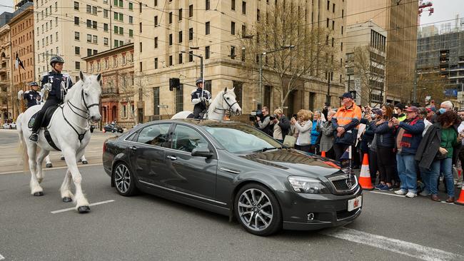 Governor Frances Adamson and her husband Rod Bunten are driven across the road to Parliament House. Picture: Matt Loxton