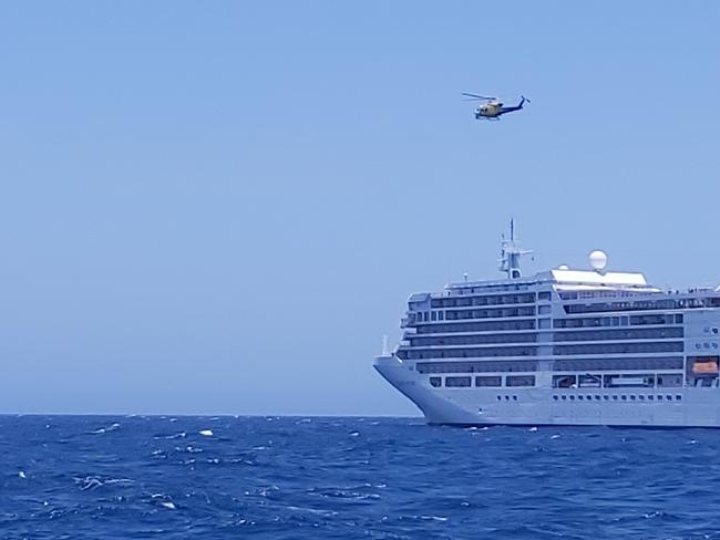 Cruise ship Silver Muse with RACQ Capricorn Rescue Helicopter approaching