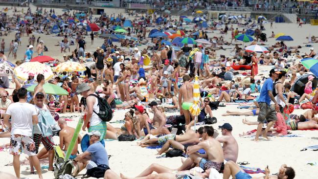 Thousands of people enjoying the hot weather on Bondi Beach.