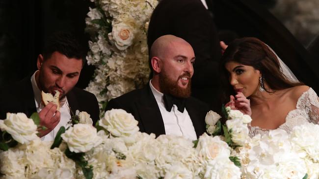 Salim Mehajer on the bridal table next to sister Kat and her new husband Ibraham during their wedding reception held at Doltone House, Hyde Park. Picture: Jonathan Ng