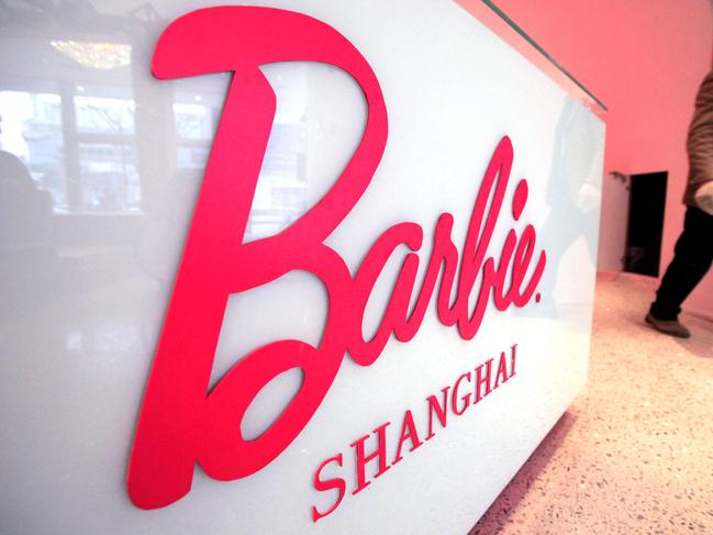 FILE - In this March 6, 2009 file photo, a worker walks in the "House of Barbie" in Shanghai, China. In 2009, Mattel opened the flagship Barbie store but closed it after just two years. (AP Photo/Eugene Hoshiko, File)