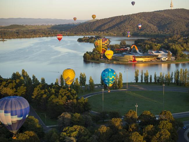 Yes, they also have hot air balloons. There’s a bunch drifting by the National Museum of Australia. Picture: VisitCanberra