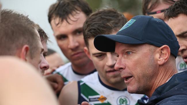 St Mary's coach Luke Rayner addresses his charges during the break. Picture: Alan Barber