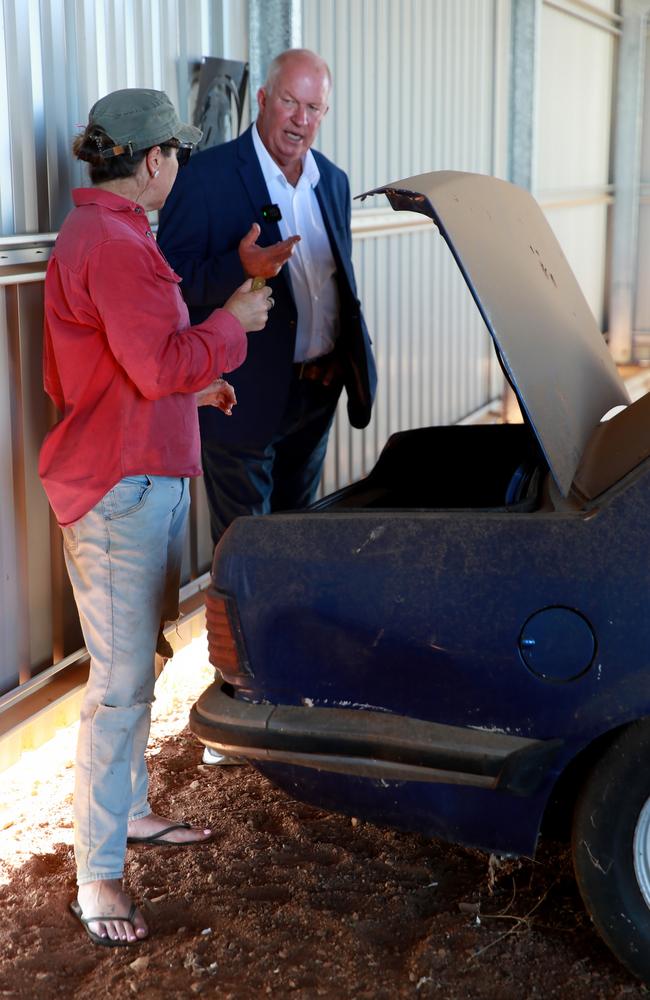 Ex detective and cold case specialist Damian Loone and Rachelle Childs sister Kristy open the boot of Rachelle's Commodore. Picture: Jeff Darmanin