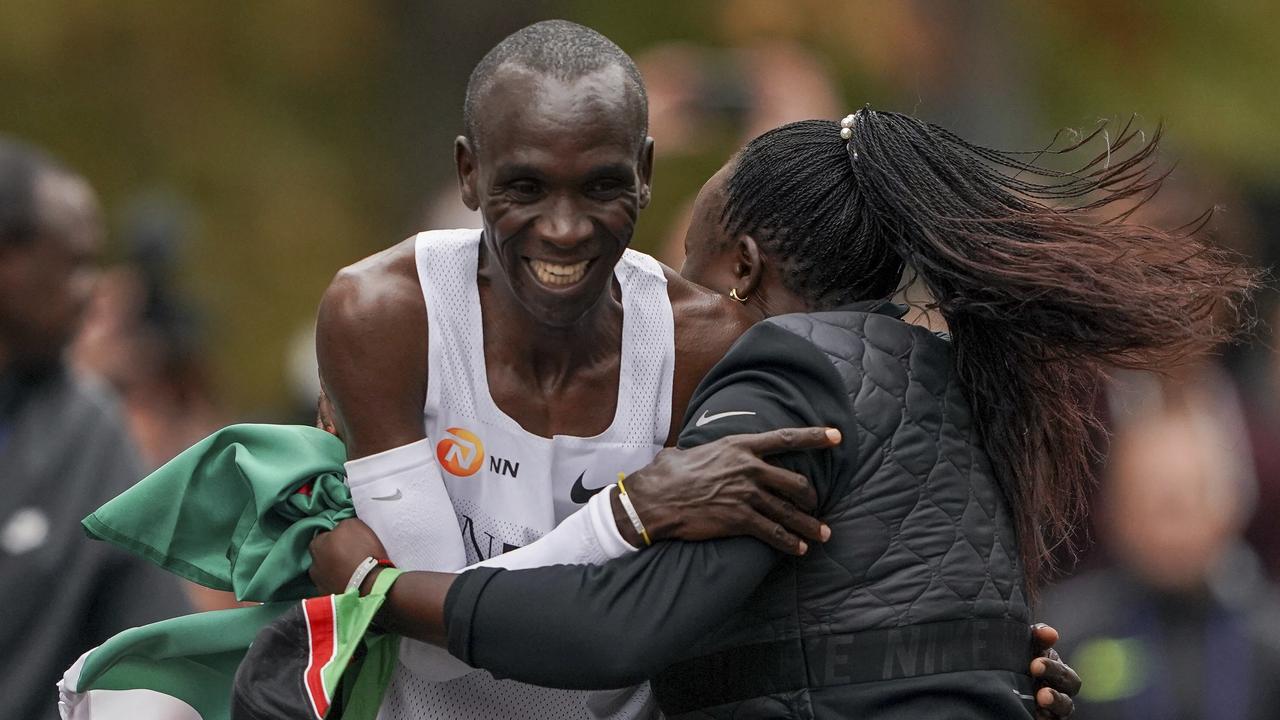 Eliud Kipchoge is hugged by his wife Grace Sugutt after his marathon excellence.