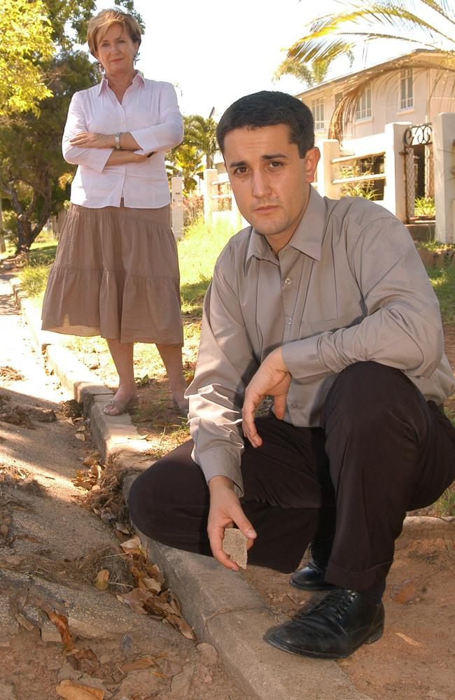 Fay Barker and David Crisafulli pictured together inspecting a drainage gutter in Stagpole Street, West End. Picture: Davey Rintala