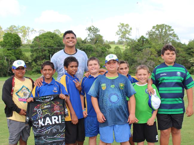 Indigenous All Stars player Latrell Mitchell with Murgon State School students Robert Langton, Rueben Simpson, Gordon Tapau, Joeseph Smith, Jo-Corey Conlon, Jaydarein Prior, Christian Fisher and Che Conlon.