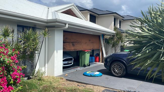 Scenes at the Helensvale home hours after Clayton’s home invasion saw a Maserati stolen and a Porsche damaged. Picture: Lea Emery