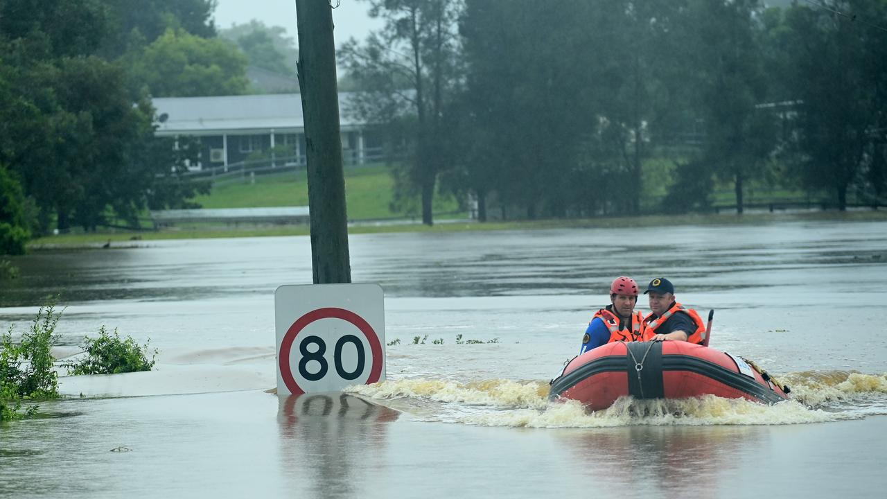 An SES boat patrols the flooded waterways of the Hawkesbury River in Vineyard, NSW. Rain continues across the state threatening homes. Picture: NCA NewsWire / Jeremy Piper