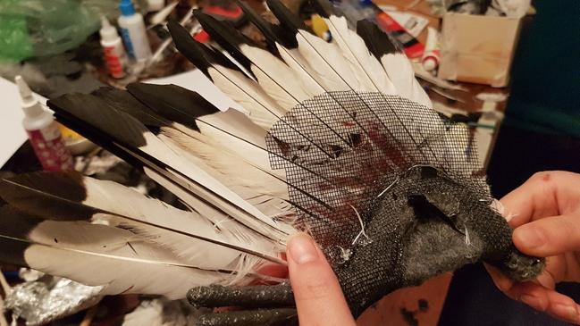 Adding feathers.