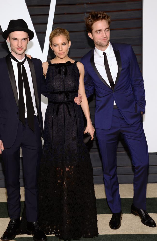 Tom Sturridge, \Sienna Miller and Robert Pattinson arrive at the Vanity Fair Oscar Party.