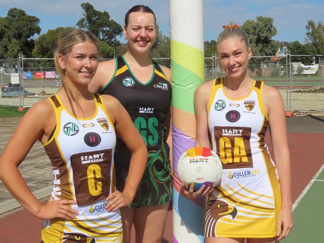 Hawks under-19s player Olivia Bender, Cavaliers captain Hayley McDougall and Hawks shooter Dani Laugher before the TNL grand final rematch in Friday night's Pride Round. Picture: Jon Tuxworth