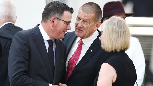 Former Victorian premier Jeff Kennett grabs current premier Daniel Andrews (L) after the State Funeral Service for Ronald Walker at St Paul's Cathedral on February 7, 2018 in Melbourne. Picture: Michael Dodge/Getty Images