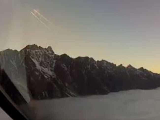 The video starts off with stunning snow-capped mountains as the pilot descends in to Queenstown airport.