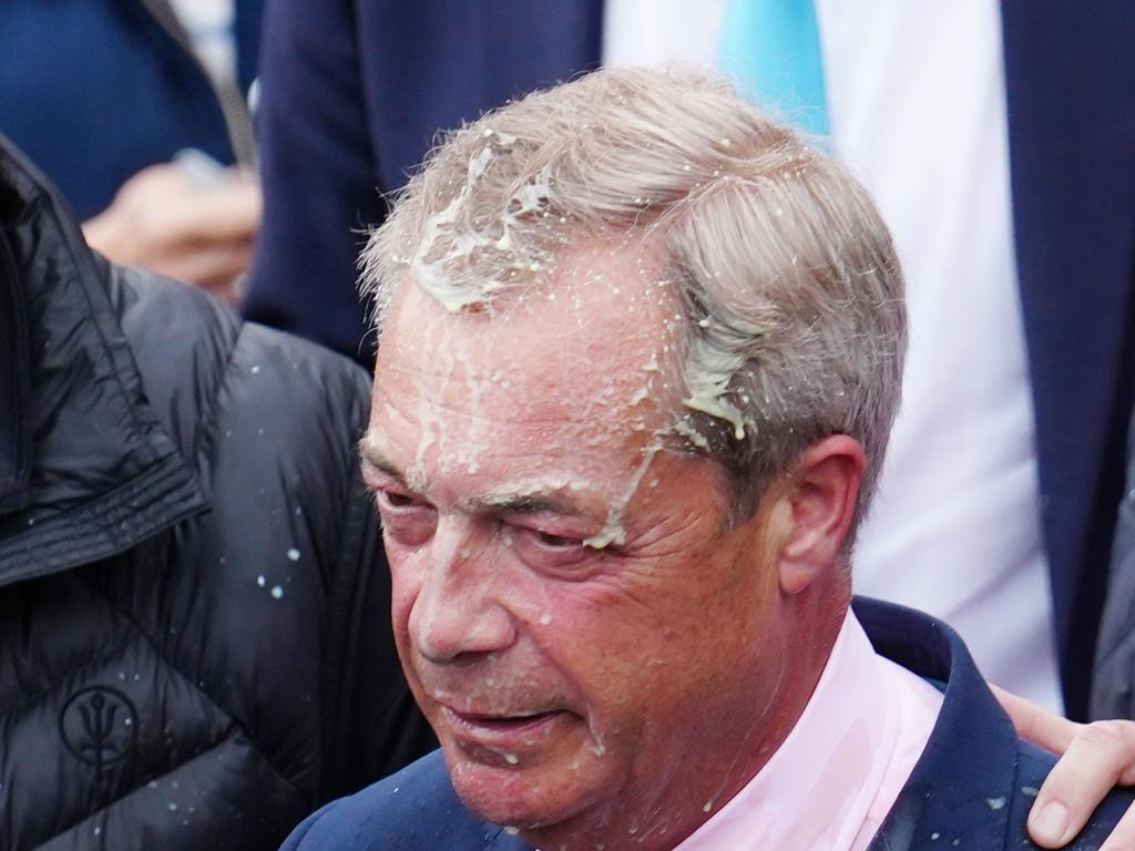 Reform UK party leader Nigel Farage reacts after a drink was thrown on him in Clacton. (Photo by Carl Court/Getty Images)