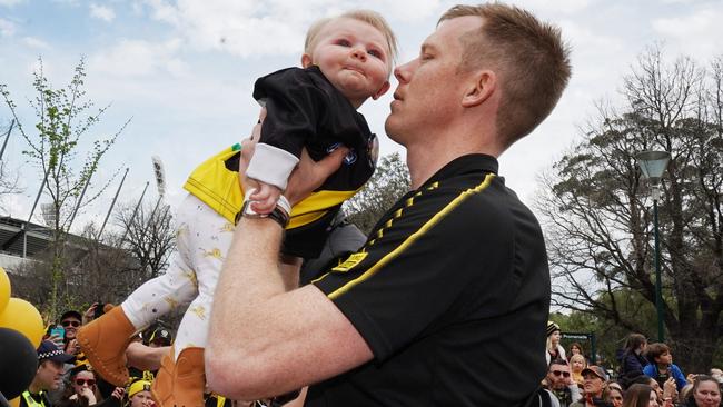 Jack Riewoldt enjoys the parade with his daughter. Picture: AAP