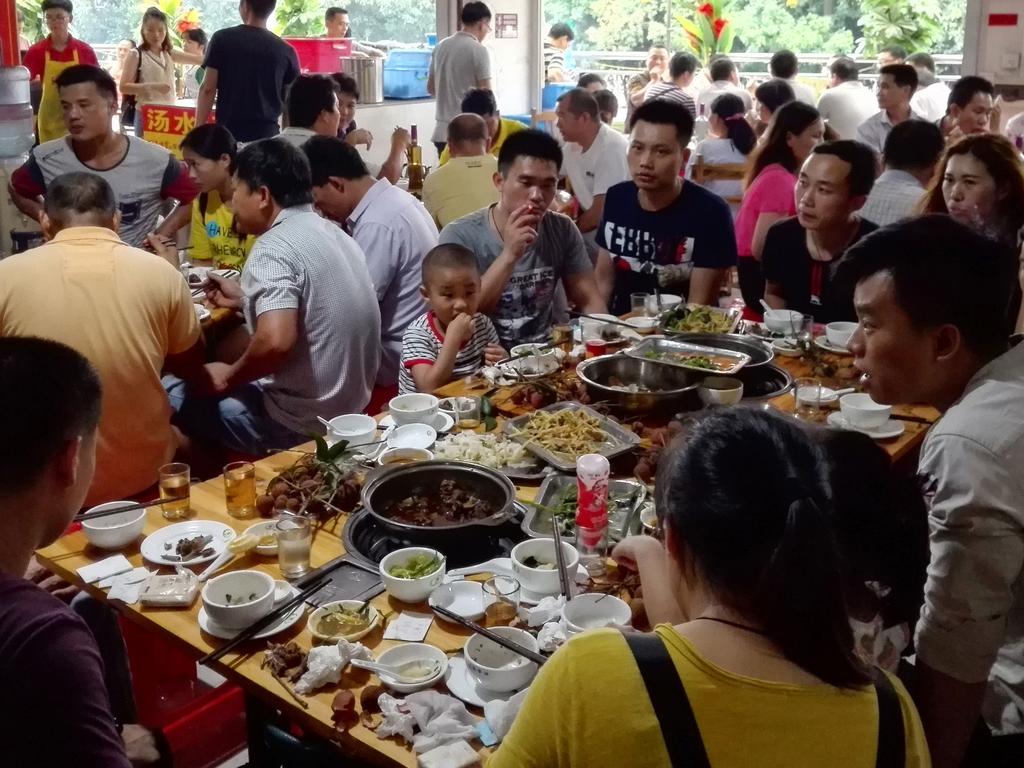 People eat dog meat at a restaurant in Yulin, in China's southern Guangxi region.