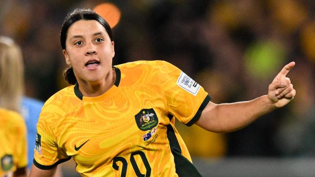 FILES-- This file photo taken on August 16, 2023 shows Australia's forward Sam Kerr celebrating scoring her team's first goal during the Australia and New Zealand 2023 Women's World Cup semi-final football match between Australia and England at Stadium Australia in Sydney. Chelsea and Australian women's football star Sam Kerr has been charged with a "racially aggravated offence" in Britain following a dispute involving a police officer, London's Metropolitan Police said March 4. The 30-year-old striker, one of the highest profile and best-paid players in the women's game, was charged following an incident in London in January 2023, a police statement read. (Photo by IZHAR KHAN / AFP)