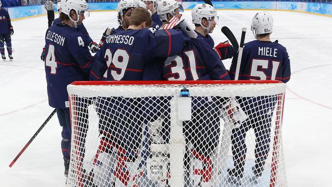 United States players gather around goaltender Strauss Mann after their shootout loss. Picture: Getty Images