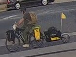 CCTV shows a person, believed to be Mr McLean, riding an electric bike with a trailer in Wangaratta. Picture: Victoria Police