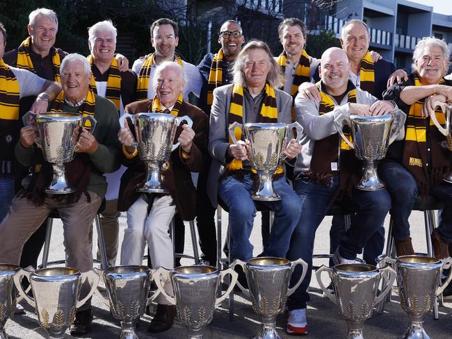 Peter Hudson (holding trophy far left) with fellow Hawthorn legends as the club celebrates its 100th birthday this week. Picture: Michael Klein