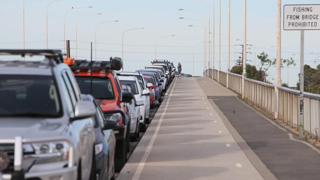 South Australians line up in their cars to be tested for coronavirus at Mundy Street, Port Adelaide, on Wednesday. Picture: Emma Brasier