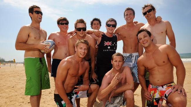 The lads enjoying a game of touch footy on Mooloolaba beach.