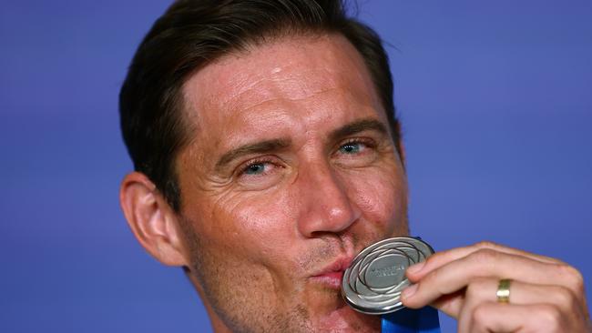 Matt Ebden kisses with the Newcombe Medal. (Photo by Graham Denholm/Getty Images for Tennis Australia)