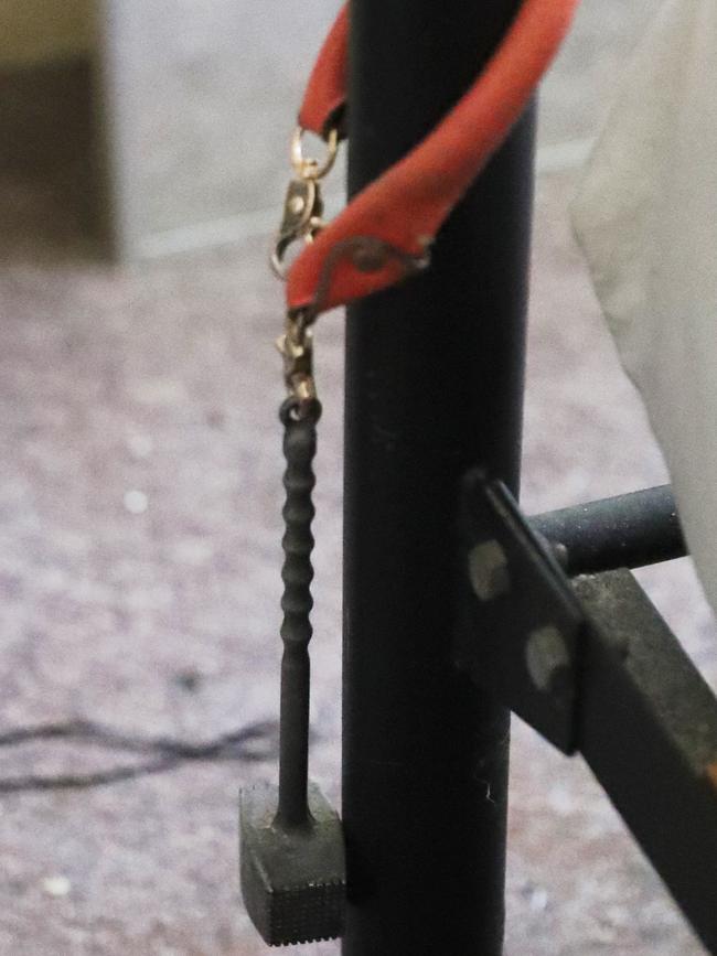 A meat hammer on the end of a bed inside Belinda Marriott’s unit in a housing commission complex residents have dubbed “The Ice Palace”. Picture: John Grainger