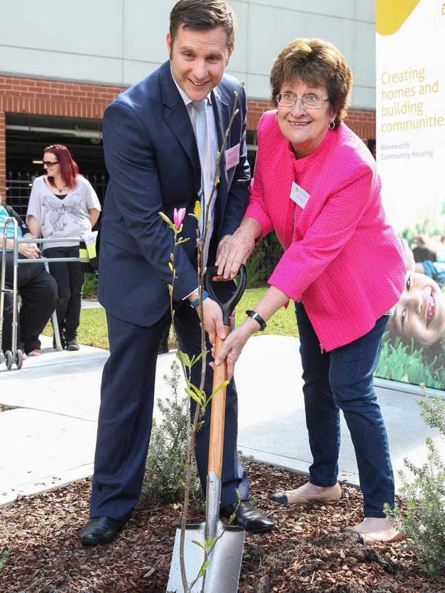 Federal MP Alex Hawke and Ann planting a tree.