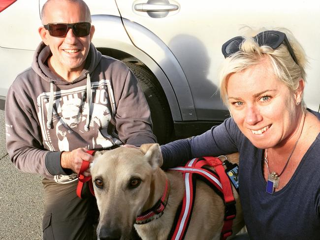 Kylie Miller and husband Brett with Albert on adoption day in Canberra.