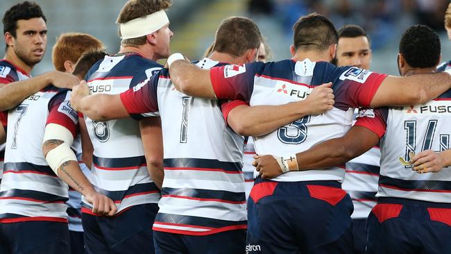 **FILE** A Saturday, April 30, 2016 image reissued Monday, April 10, 2017 of Rebels players at the start of the Round 10 Super Rugby match between the Blues and Melbourne Rebels at Eden Park in Auckland. The Western Force and Melbourne Rebels will learn within three days which of them is to be axed, Australian Rugby Union chairman Cameron Clyne says. It's part of a broader restructure of an unwieldy and unpopular Super Rugby competition format, which is to be slashed from 18 teams to 15 after this season, with two South African sides also to go. (AAP Image/David Rowland) NO ARCHIVING, EDITORIAL USE ONLY