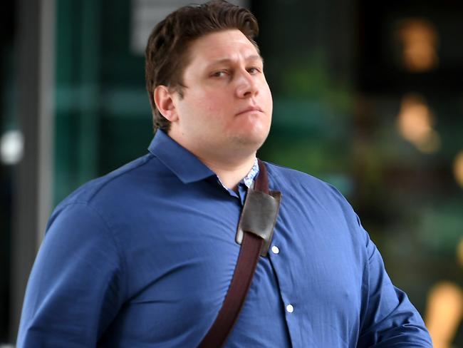 Christopher Tsompanoudis beinf sentenced for 51 counts of making observations or recordings in breach of privacy exits the Brisbane Magistrates court.  Tuesday March 10, 2020. (AAP image, John Gass)