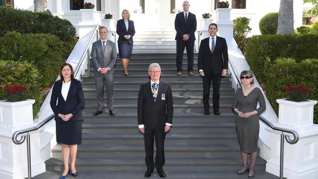 Observing social distancing, Queensland Governor Paul de Jersey, centre, his wife Kaye de Jersey, bottom right, along with Premier Annastacia Palaszczuk, bottom left, and the newly sworn-in ministers at Government House in Brisbane on Monday. Picture: AAP