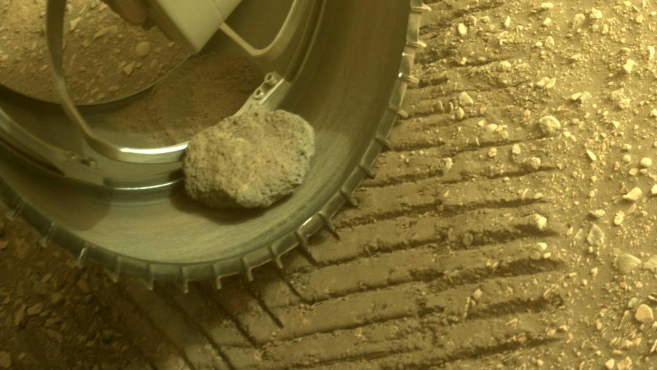 NASA's Perseverance rover has carried this rocky hitchhiker about 8.5km across Mars. The picture of the rock was captured by the rover’s front left Hazard Avoidance Camera A on May 26, 2022. Picture: NASA/JPL-Caltech
