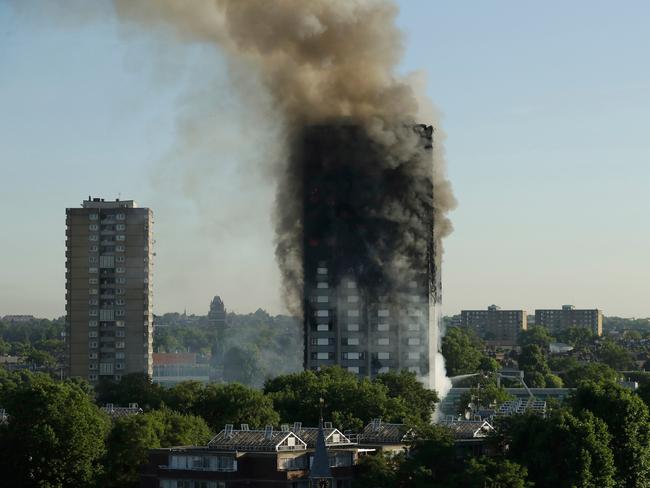 Smoke continuing to rise from the Grenfell Tower blaze last June which is now the subject of a public inquiry. Picture: Matt Dunham
