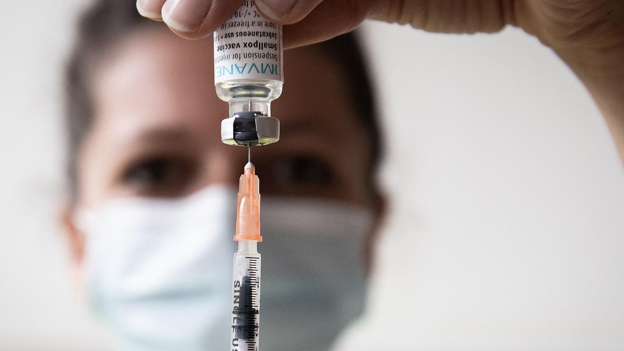 A medical health worker prepares a dose of the Monkeypox vaccine.