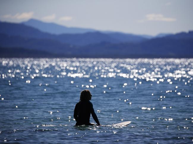 A surfer in the water near Cape Byron, Byron Bay / Picture: Dylan Robinson