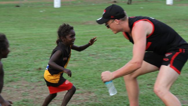 Essendon's first to forth-year players spent the day with Tiwi Islands students. Picture: NATALIE MacGREGOR