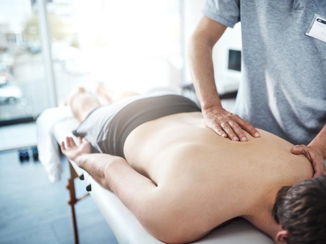 Closeup shot of an unrecognizable physiotherapist treating a patient