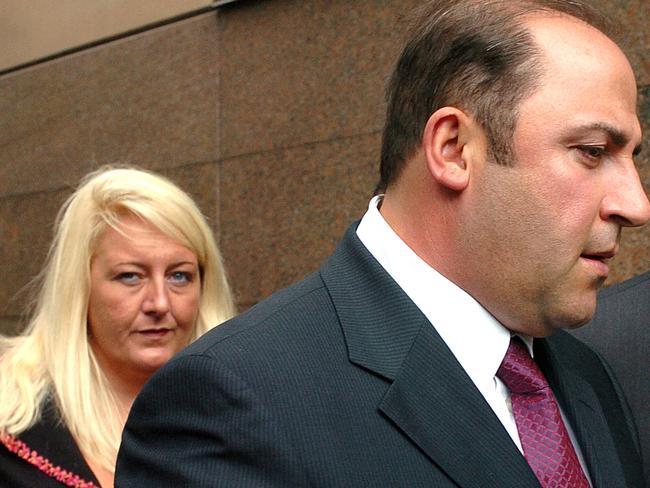 15 Nov 2004 : Gangland boss, Tony Mokbel with his legal team Nicola Gobbo (left) and Con Heliotis QC (right) outside the Magistrates Court - crime Vic drugs headshot mobile phone profile